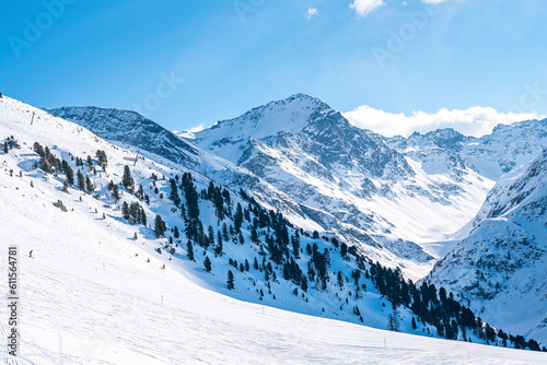 Idyllic snowy mountain range against sky in alps