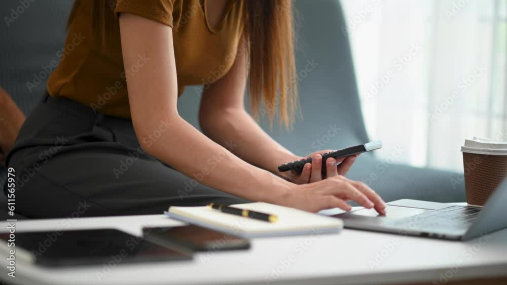 Close up of businesswoman or accountant hand typing laptop working to calculate on desk about cost at office.. Close up of businesswoman or accountant hand typing laptop working to calculate on desk about cost at office..