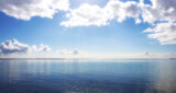 Seascape, cloud and sky with space in outdoor with mockup in south africa for travel in summer. Water, environment and calm or ocean with horizon in background for holiday or banner in nature.