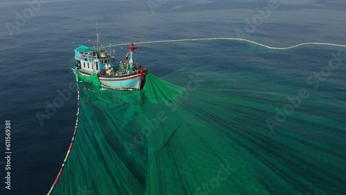 Crew of Fishermen Work on Commercial Fishing Ship that Pulls Trawl Net, Yen island, Phu Yen, Vietnam photo