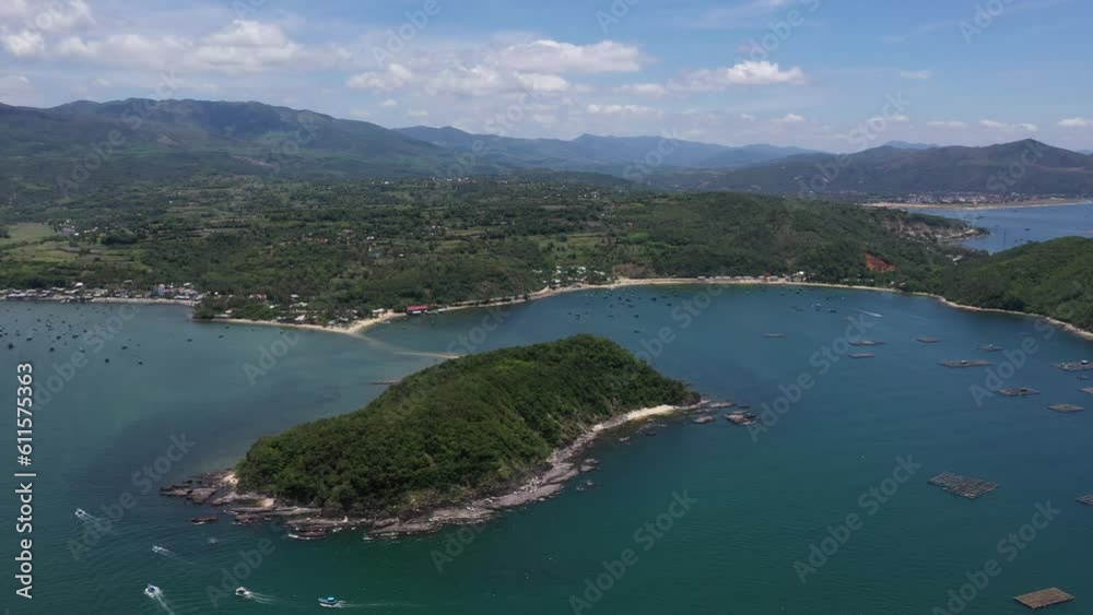 Aerial drone video of tropical paradise exotic Cu Mong lagoon, Nhat Tu Son island covered in limestone trees with emerald crystal clear beach and Lobster farm in Phu Yen, Vietnam
Aerial drone video of tropical paradise exotic Cu Mong lagoon, Nhat Tu Son island covered in limestone trees with emerald crystal clear beach and Lobster farm in Phu Yen, Vietnam