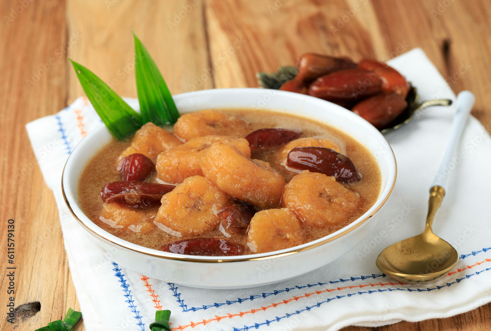 Kolak Pisang Kurma, Banana Compote with Dates Fruit, Popular Food beverages for Ifthar. Kolak Made from Coconut Milk and Palm Sugar with Various Topping