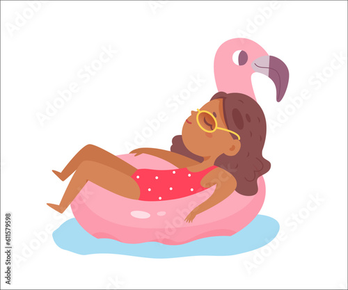 Cute girl floating on inflatable flamingo on beach pool party, happy kid in bikini