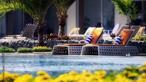 Sun Loungers at a Swimming Pool Inside a Luxury Sub-Tropical Resort
