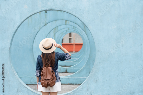 Wall Mural Young woman traveler visiting at Lok Wah South Estate Circle Round spot for photography tourist