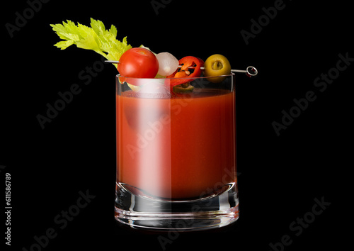 Classic hot bloody mary cocktail mix with vodka and tomato juice on black background. © DenisMArt