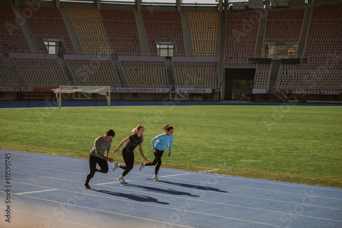 Beautiful people jogging on a sports track