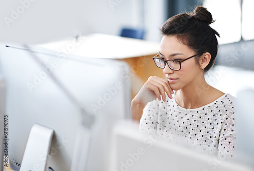 Business, thinking and woman with a computer, focus and connection with online reading, copy writer and creative. Female person, employee or consultant with a pc, search internet and editing project photo