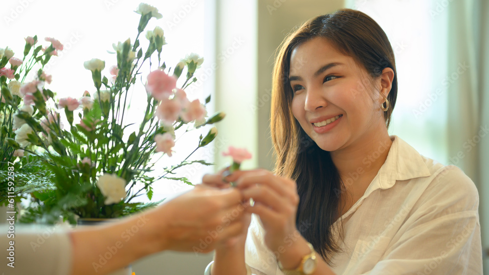 Attractive adult asian woman giving flower to her mother. Happy mother's day, love and family concept Attractive adult asian woman giving flower to her mother. Happy mother's day, love and family concept
