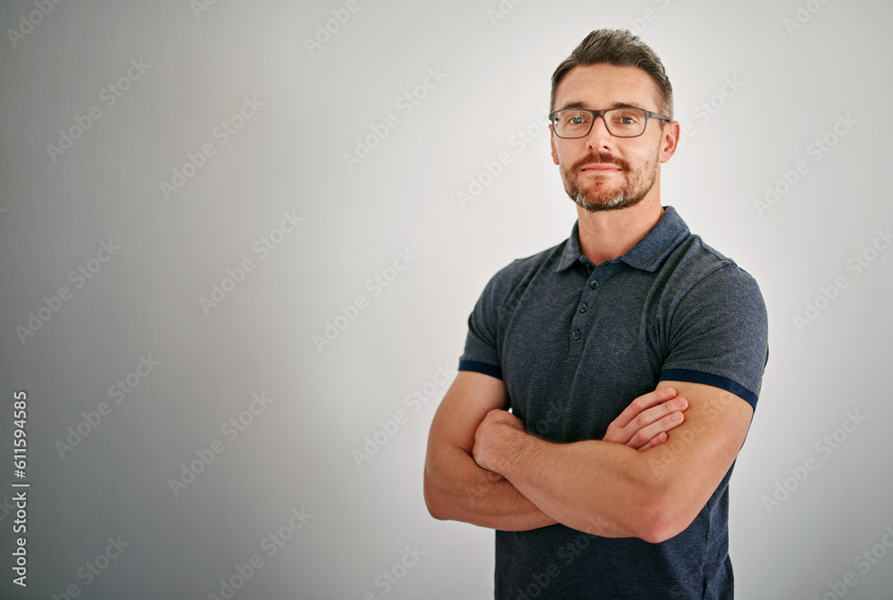 Mockup, portrait and mature man with arms crossed, calm and casual outfit against a grey studio background. Face, male person and model with glasses, Canada and peace with confidence and happiness Mockup, portrait and mature man with arms crossed, calm and casual outfit against a grey studio background. Face, male person and model with glasses, Canada and peace with confidence and happiness