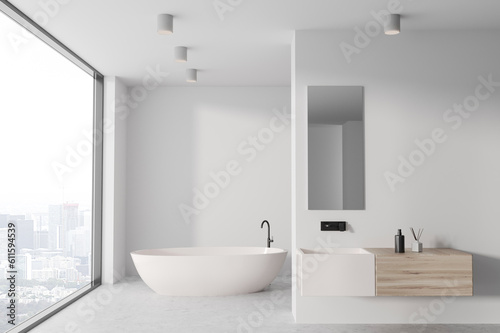 Stylish bathroom interior with sink and bathtub  window and mockup wall