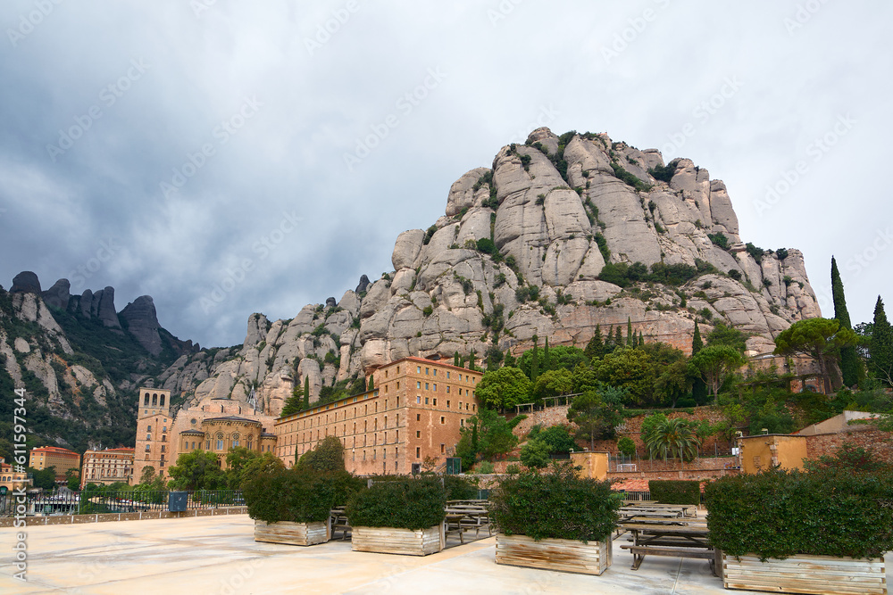 Santa Maria de Montserrat in Monistrol, on a partly cloudy day in Catalonia, Spain.