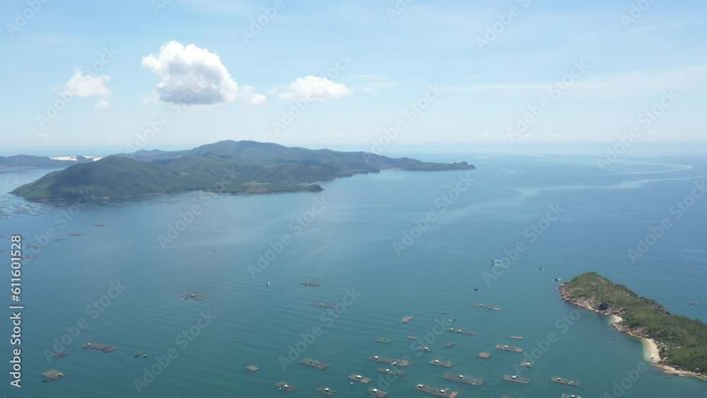 Aerial drone video of tropical paradise exotic Xuan Dai bay covered in limestone trees with emerald crystal clear beach and Lobster farm in Phu Yen, Vietnam Aerial drone video of tropical paradise exotic Xuan Dai bay covered in limestone trees with emerald crystal clear beach and Lobster farm in Phu Yen, Vietnam