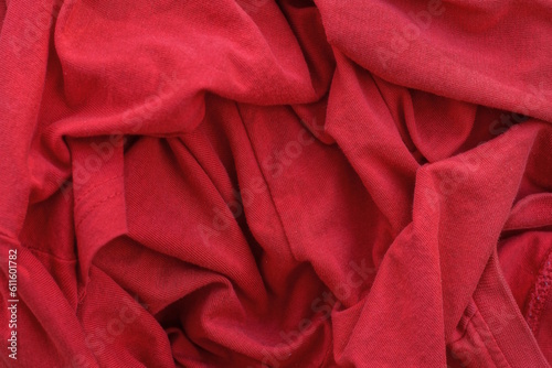 red texture from a piece of crumpled fabric on old clothes