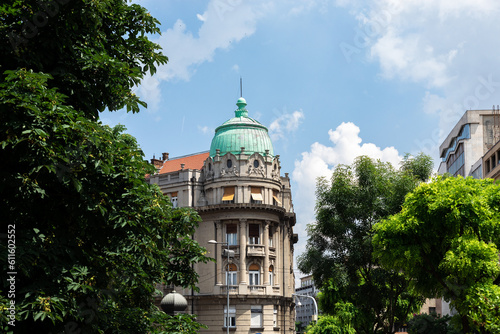 Part of a classical building in Belgrade. A building with a rotunda on the corner. photo