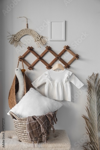 Minimalist white baby girl dress with long sleeve mockup for presentation cute sublimation designs in scandinavian boho interior with minimalistic handmade cozy decoration and dried palm leaf
