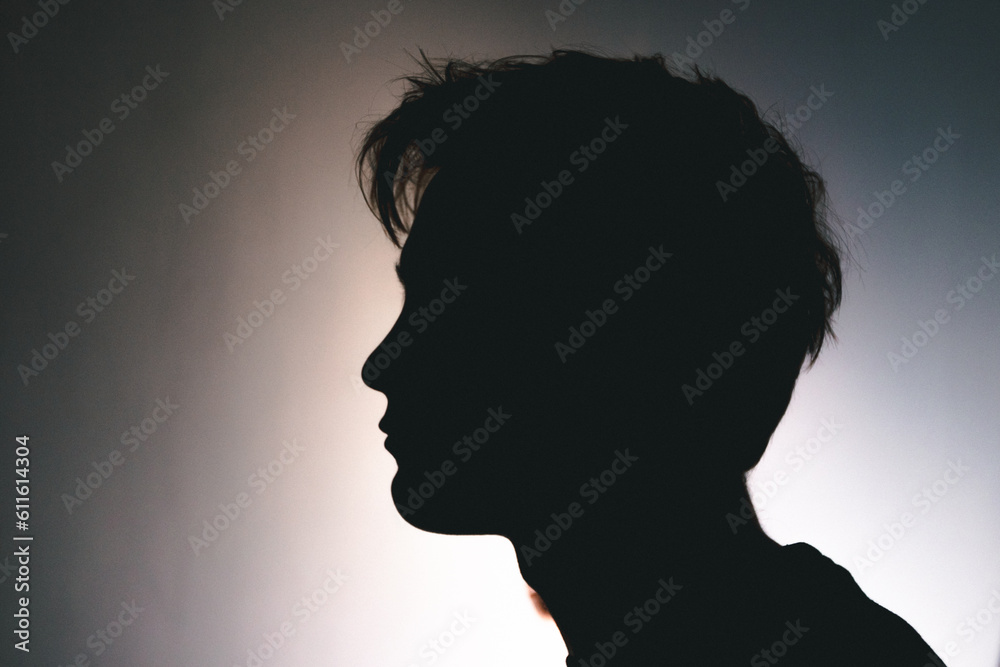 Silhouette of a man lost deep in thought