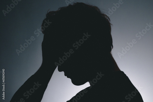 Silhouette of a depressed man 