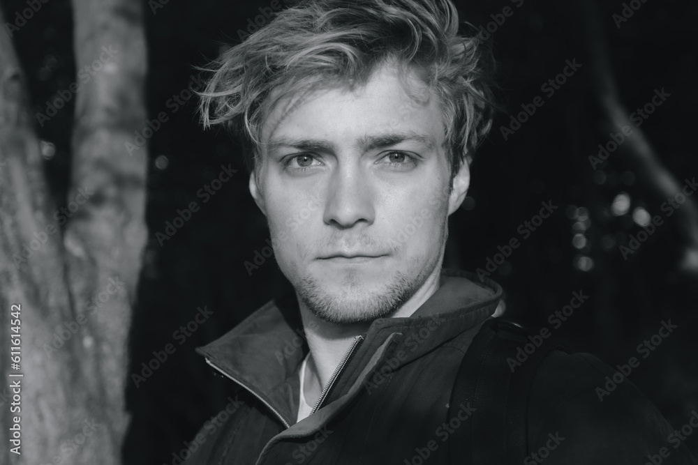 Black and white shot of a man in woodland Black and white shot of a man in woodland