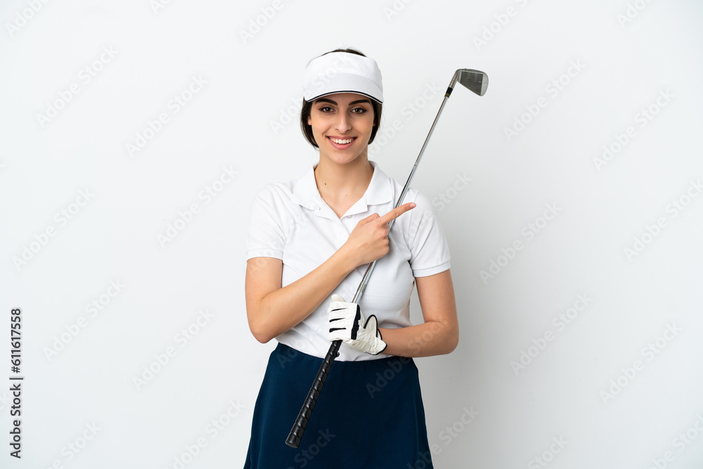Handsome young golfer player woman isolated on white background pointing to the side to present a product Handsome young golfer player woman isolated on white background pointing to the side to present a product