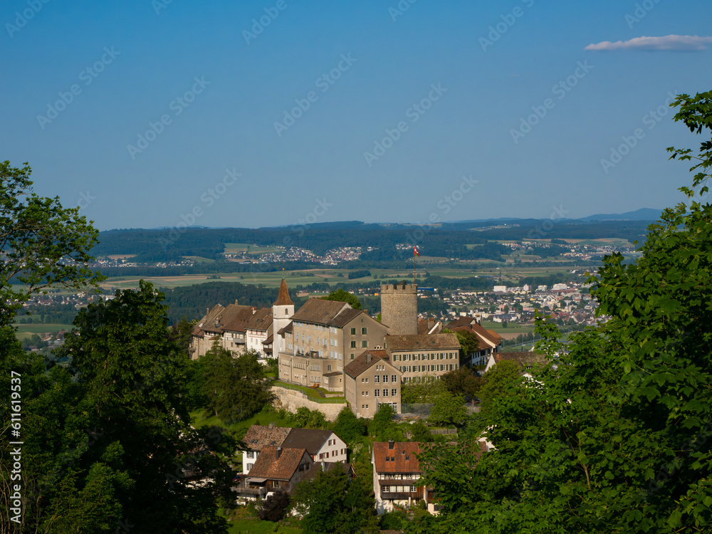Historic Medieval Castle of Regensberg near Zurich with Stone Tower and Wall against Blue Sky Background. View from Above. Landscape format.