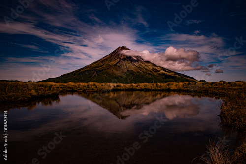 New Zealand, Mount Taranaki is the symmetrical volcanic cone that rises from sea level to 8,260 ft (2,518 m). This mountain is located in Egmont National Park, North Island of the New Zealand.