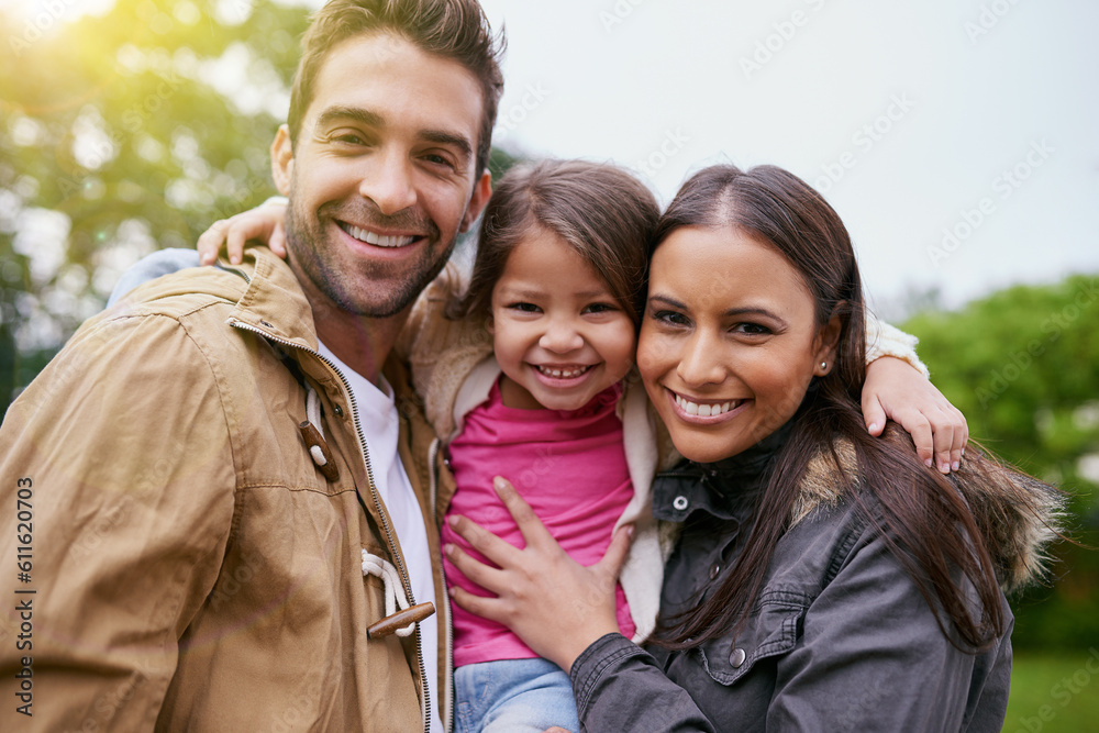 Family, happy hug and park portrait with a mom, dad and girl together with happiness and smile. Outdoor, face and vacation of a mother, father and young kid with bonding, parent love and child care Family, happy hug and park portrait with a mom, dad and girl together with happiness and smile. Outdoor, face and vacation of a mother, father and young kid with bonding, parent love and child care