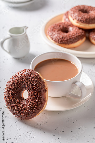 Colorful and tasty pink donuts and coffee ready to eat.