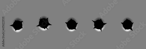 Bullet holes set isolated on grey background. Realistic ragged metal holes row. Damage effect