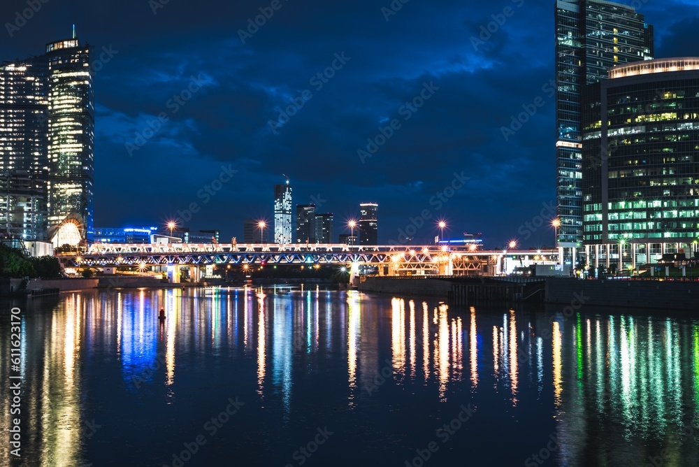 Moscow, Russia - 8 June 2023: Night panoramic photo of Moscow skyscrapers against the background of the bridge of the Third Transport Ring, Moscow City.