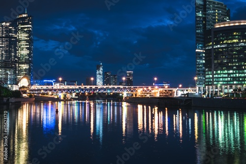 Moscow, Russia - 8 June 2023: Night panoramic photo of Moscow skyscrapers against the background of the bridge of the Third Transport Ring, Moscow City.
