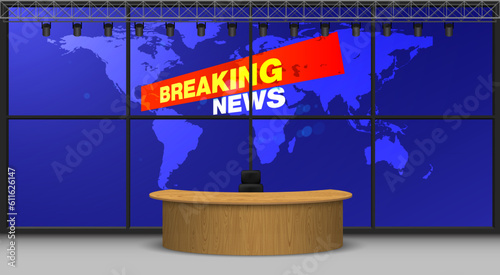 wooden table and breaking news on lcds background in the news studio room
