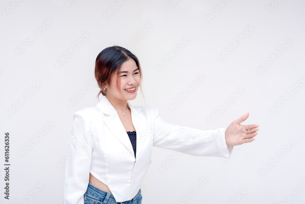 A friendly young woman holding her hand out to offer a handshake on the right side. Isolated on a white background. A friendly young woman holding her hand out to offer a handshake on the right side. Isolated on a white background.
