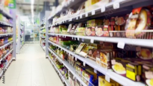 Wallpaper Mural Choosing a dairy products at supermarket.Grocery stores .blurred background Torontodigital.ca