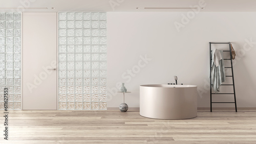 Minimal bathroom with round bathtub and decors in white and beige tones. Glass brick walls  ladder towel hanger and bleached parquet. Modern interior design idea with copy space