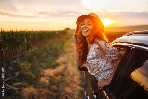 Towards adventure! Happy woman is enjoying the trip in the car. Lifestyle, travel, tourism, nature, active life.