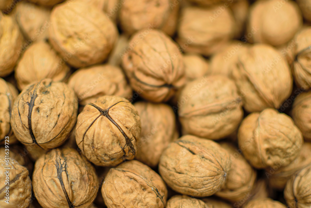 Image of walnuts stocked in market for consumption. Image of walnuts stocked in market for consumption.