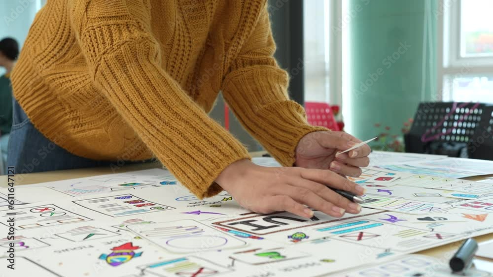 Close up ux developer and ui designer brainstorming interface wireframe design.Creative digital development agency Close up ux developer and ui designer brainstorming interface wireframe design.Creative digital development agency