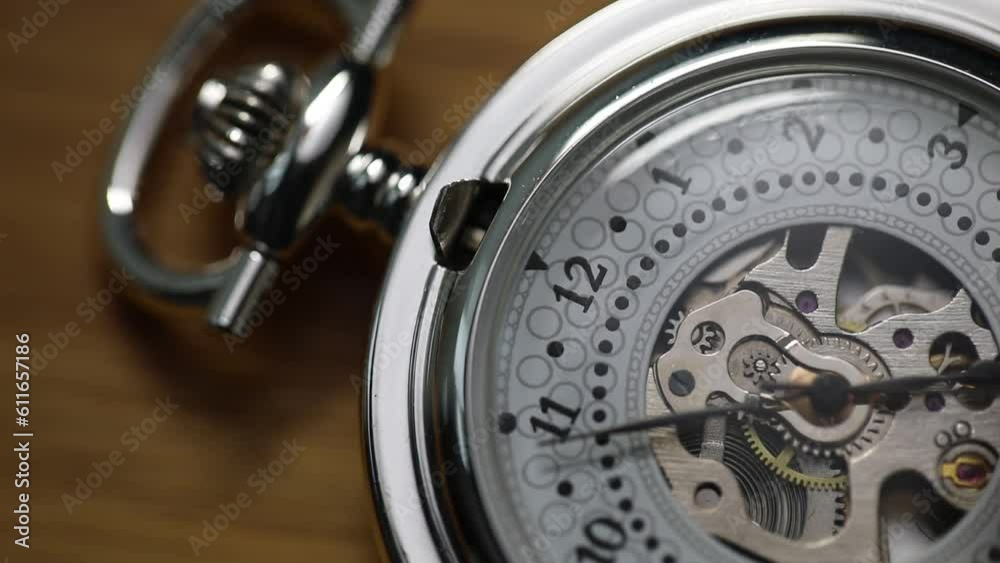 pocket watch on a table pocket watch on a table