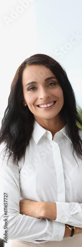 Portrait of smiling beautiful woman in white shirt. Business consultant manager and bank employee