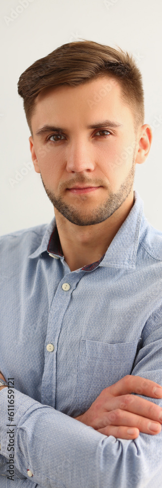 Fototapeta premium Portrait of handsome young attentive focused businessman in shirt. Business consultant manager or boss concept
