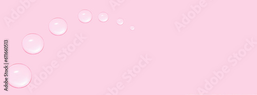 Drops of transparent gel or water in the shape of a semi-circle, with decreasing size. On a pink background. © MM