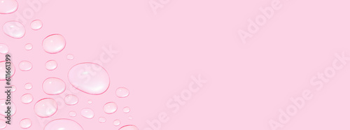 Drops of transparent gel or water in different sizes. On a pink background. © MM