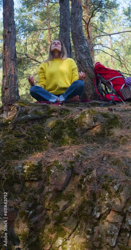 Breath with the forest and free your mind with meditation. Young woman in a morning pine forest. Solitude with your thoughts and nature. Nature as a path to mental health. Breath with the forest and free your mind with meditation. Young woman in a morning pine forest. Solitude with your thoughts and nature. Nature as a path to mental health.