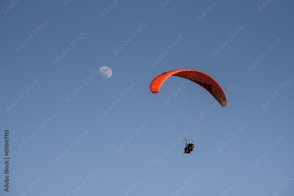 Player flying towards the moon with blue sky