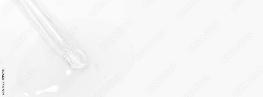 Transparent pipette with gel or liquid flowing out on a light background. Transparent pipette with gel or liquid flowing out on a light background.