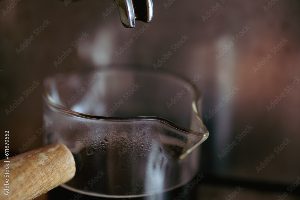Coffee machine making espresso in a cup close up Coffee machine making espresso in a cup close up
