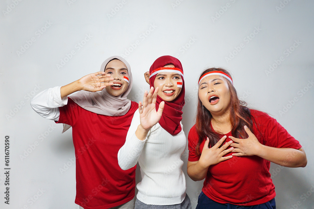 happiness of a group of young people using the red and white attributes to commemorate independence day happiness of a group of young people using the red and white attributes to commemorate independence day
