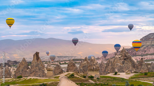 Cappadocia. Hot air balloons flying over Cappadocia in a dramatic sky. Travel to Turkey. Selective focus included. photo