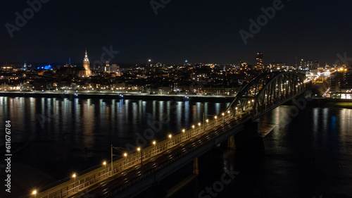 A birds-eye view of the skyline of Nijmegen at night. 